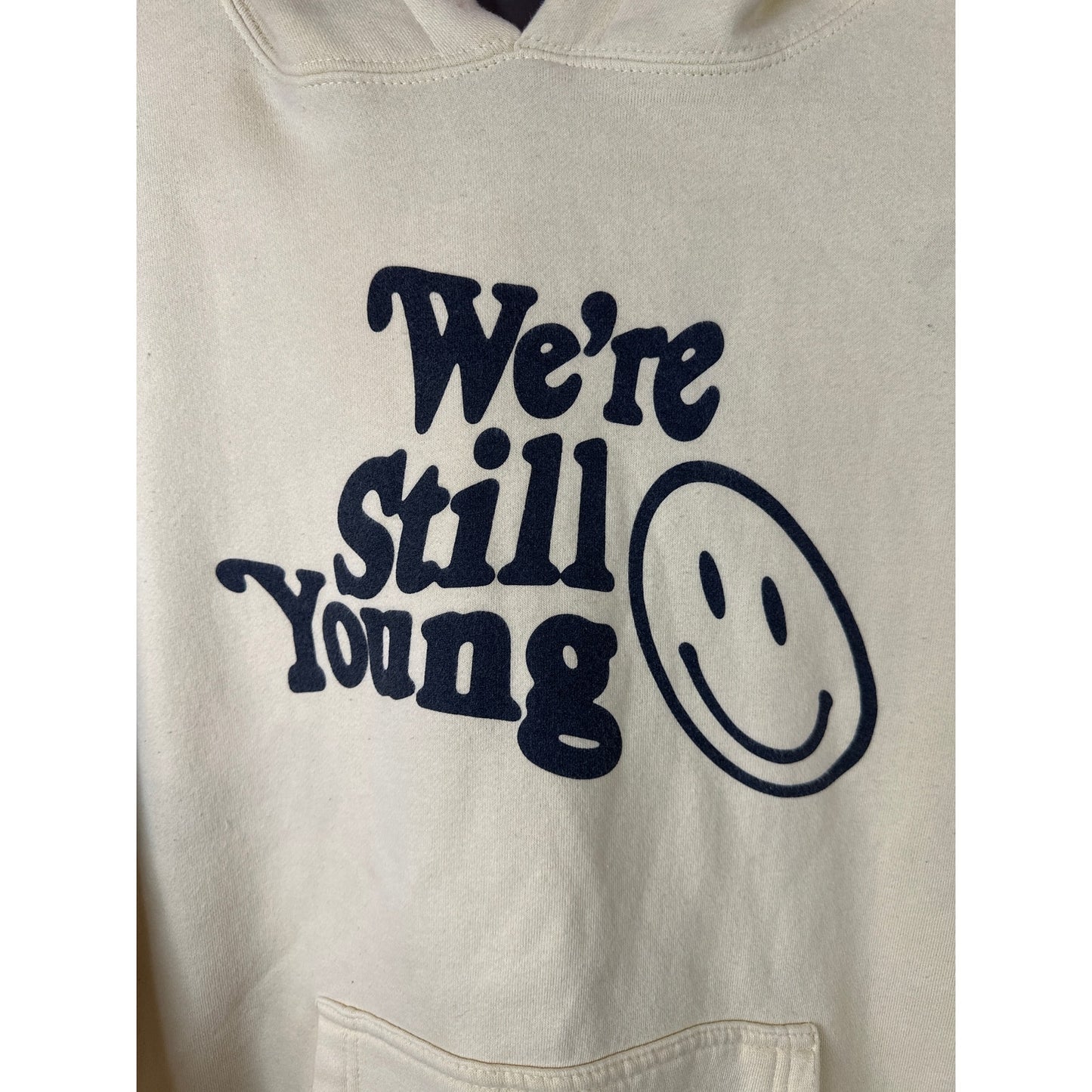 FanJoy Unisex ‘We’re Still Young’ Smiley Face Graphic Long Sleeve Hoodie Size M