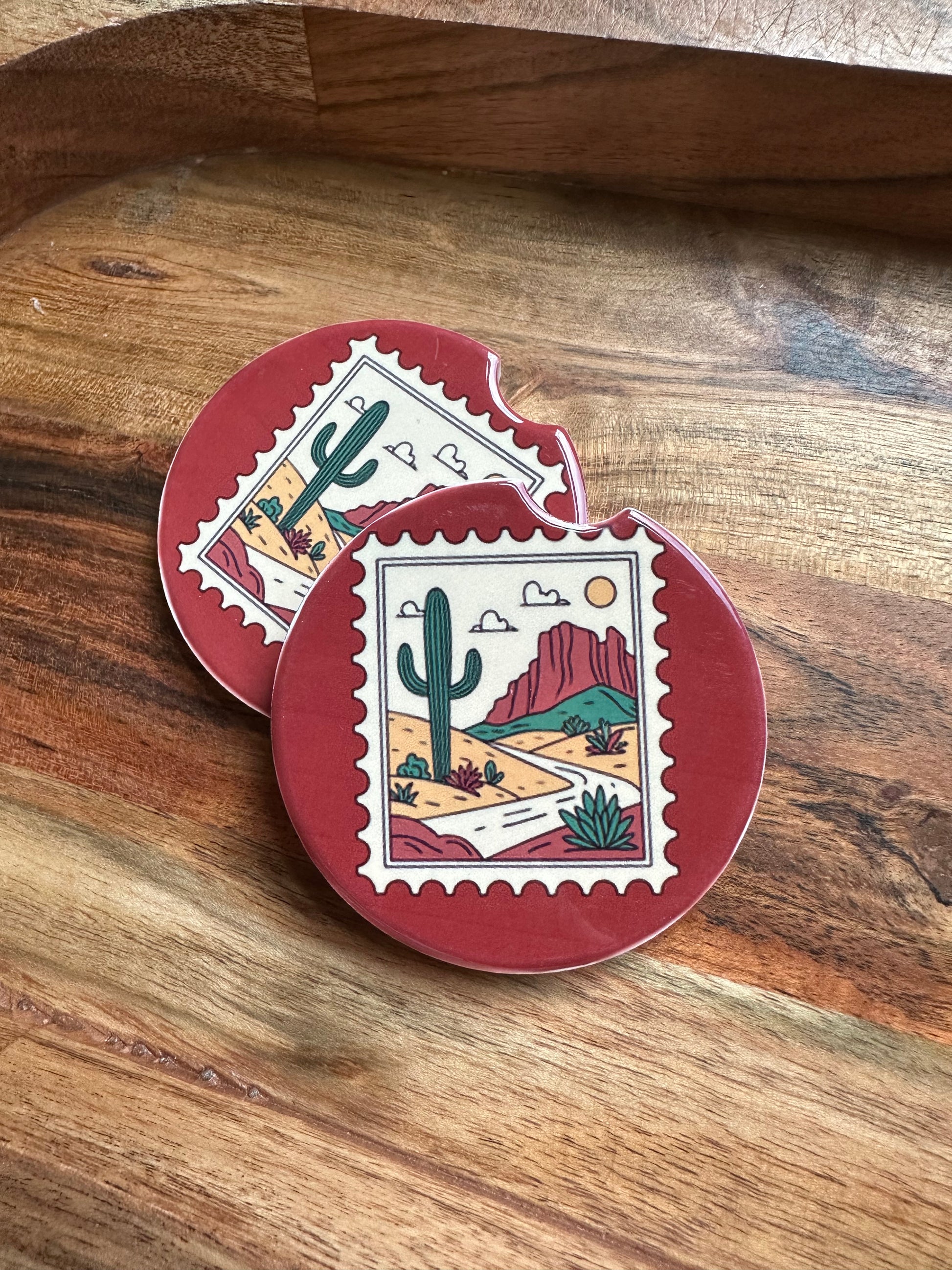 Western vintage stamp ceramic car coaster stacked on wooden background