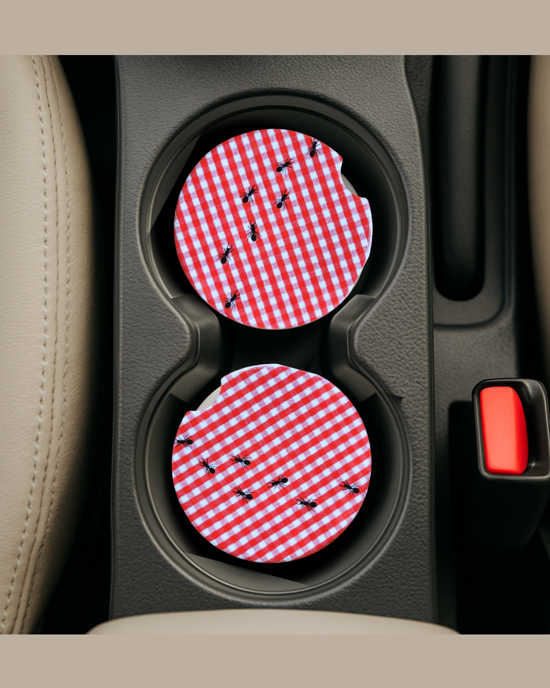 red and white gingham print picnic basket with ants ceramic car coaster in car cup holder