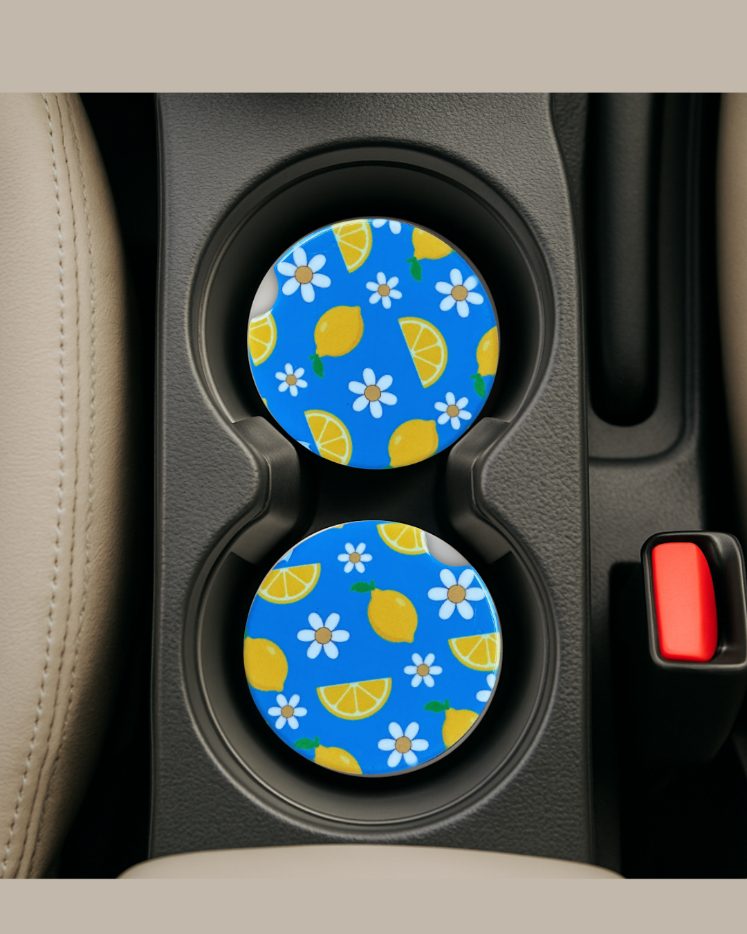 baby blue and lemon print with daisies ceramic car coaster in a car cup holder