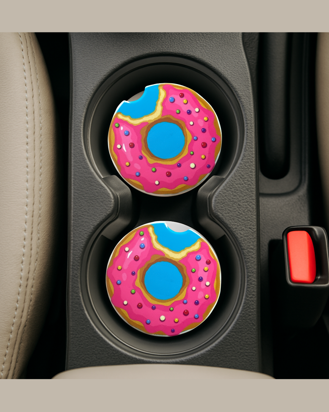 blue background with a strawberry donut on a ceramic car coaster inside car's coater