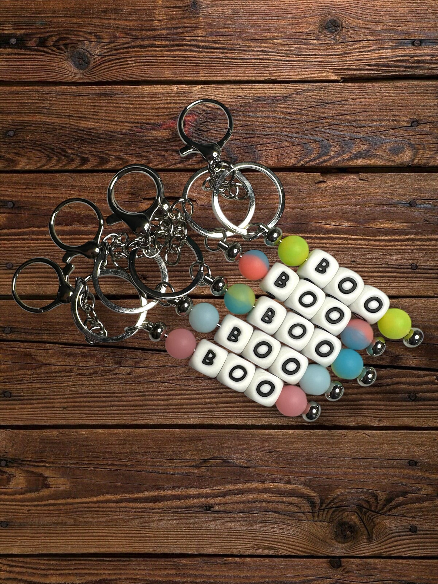 glow in the dark, 'boo' silicone beaded, silver hardware keychain