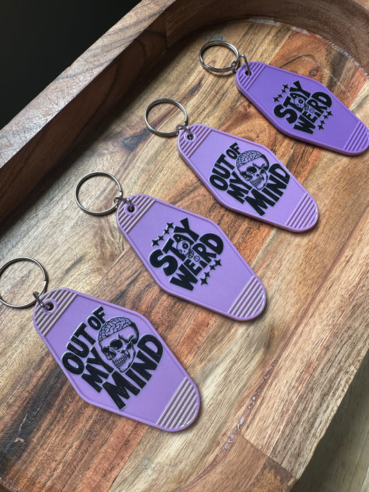 Motel Keychains- 'Stay Weird' Purple Skeleton Keychain